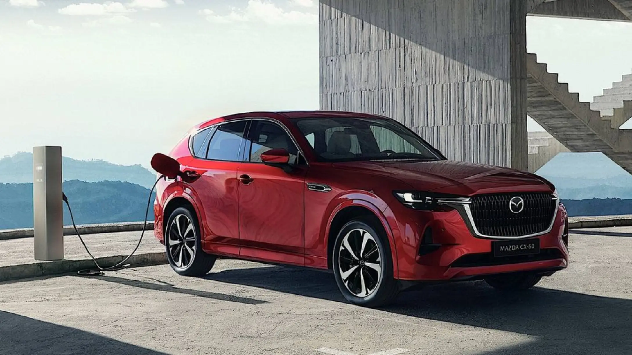  Imagen de una persona manejando el CX-60 de Mazda